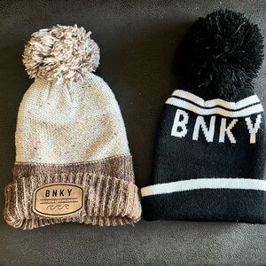 Two infant sized Binky Bro beanies.